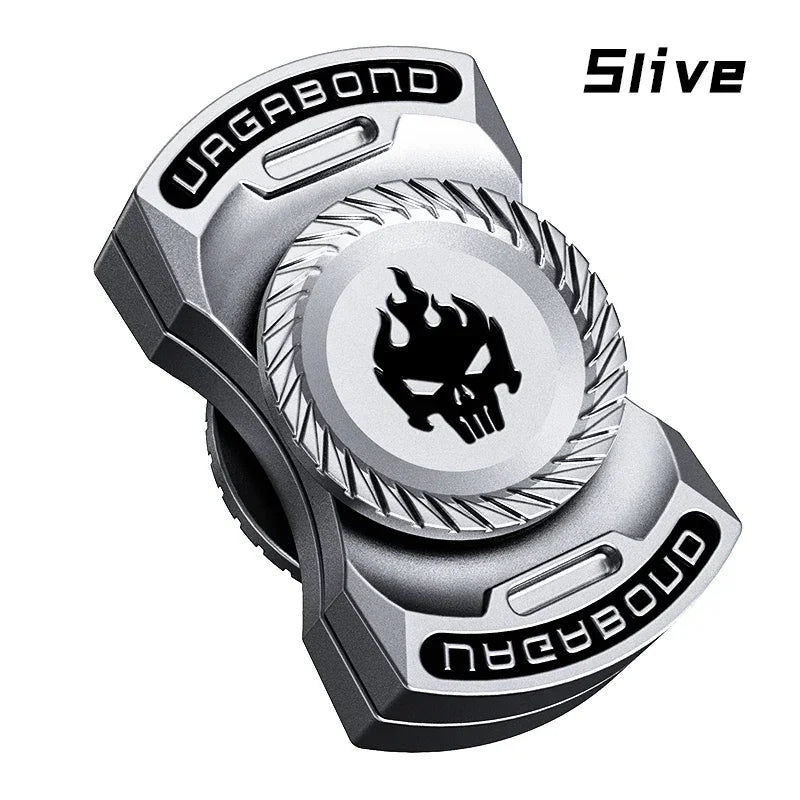 Metallic fidget spinner with skull flame design and VAGABOND text, silver color