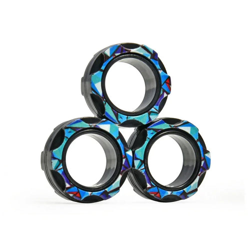 Three patterned black rings with geometric blue designs stacked on white background