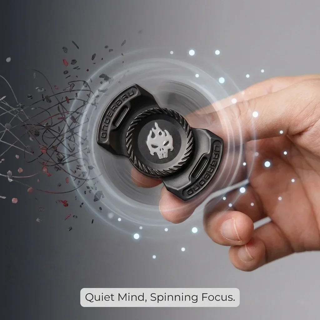 Black metal fidget spinner with skull design spinning between fingers, hand close-up