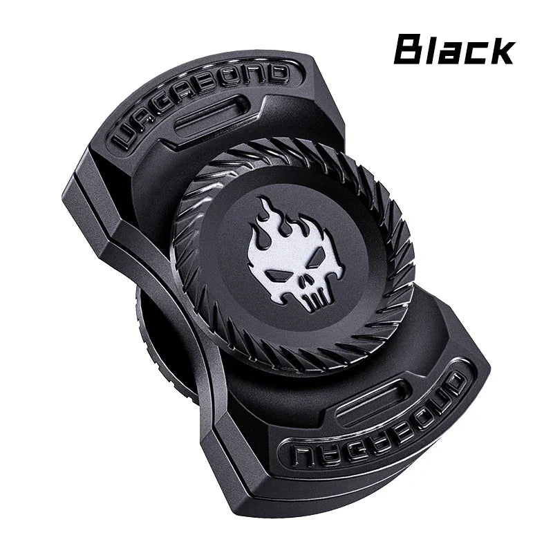 Black metal fidget spinner with skull flame design and Vagabond text, isolated on white